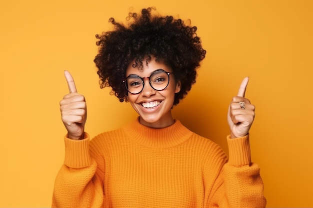 A woman with glasses and a sweater gives a thumbs up.