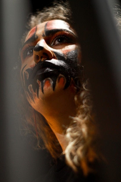 A woman with a halloween makeup looking away