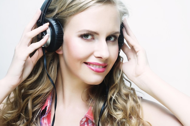 Woman with headphones listening to music