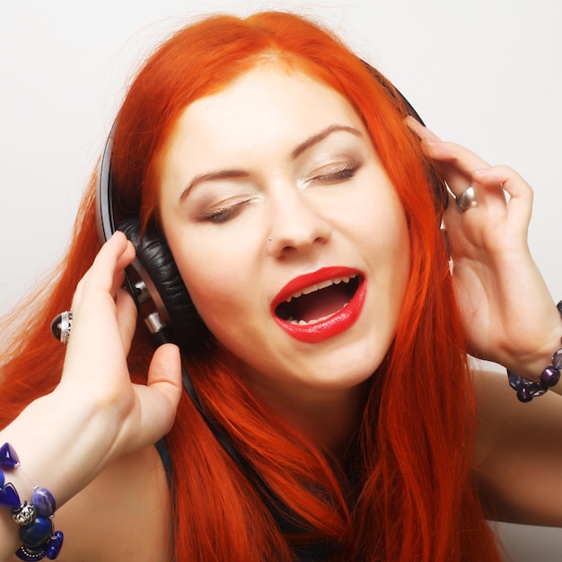 Woman with headphones listening music