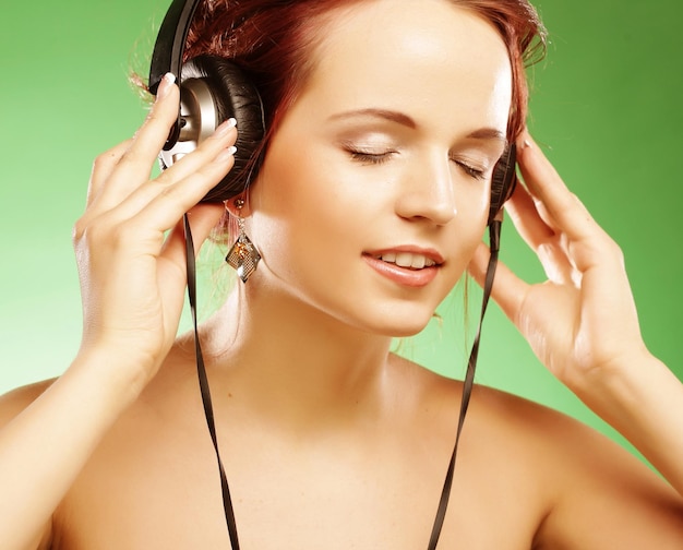 Woman with headphones listening to music