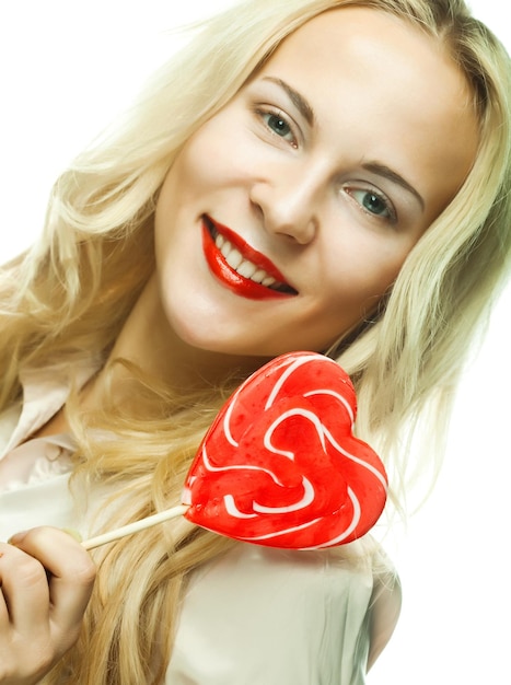 Woman with heart lolly pop