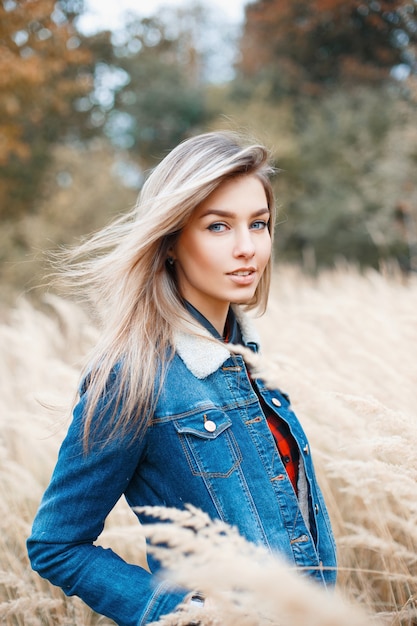 Woman with a jeans jacket outside