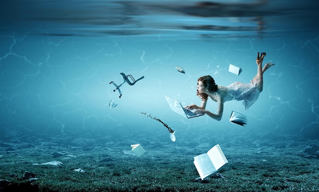 Woman with laptop underwater. Mixed media