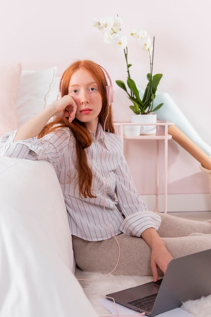 Woman with laptop working from home