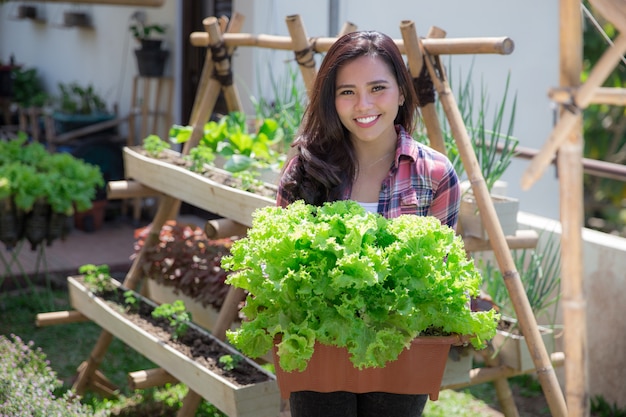 Woman with lettuce in the farm