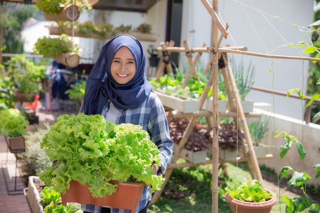 Woman with lettuce in the farm