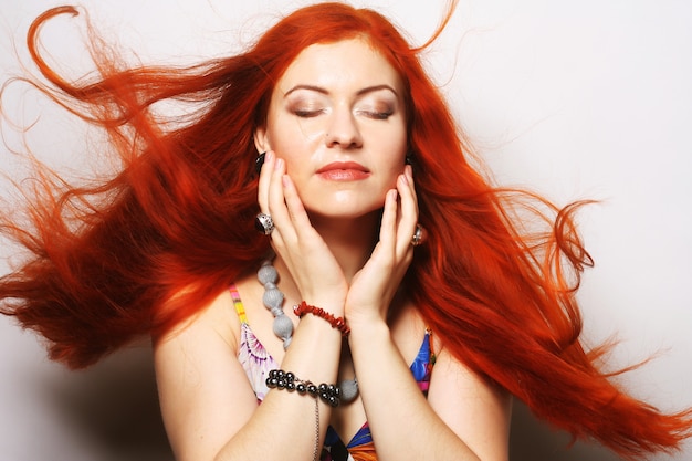 Woman with long flowing red hair