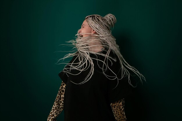 Woman with long white hair and black shirt