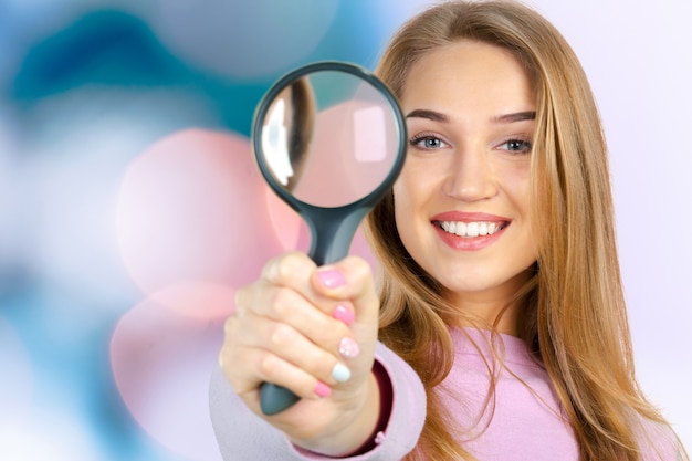 Woman with magnifying glass