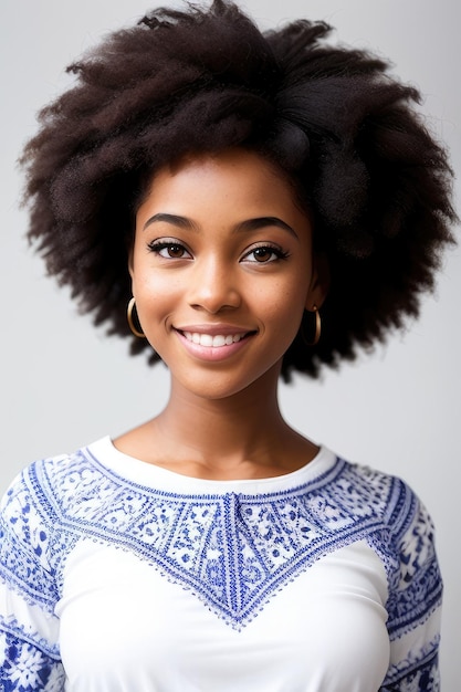 A woman with a natural haircut and a blue top.