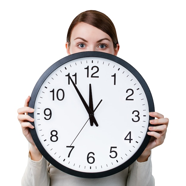 Woman with an office clock isolated on a white background