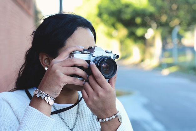 Woman with old vintage camera