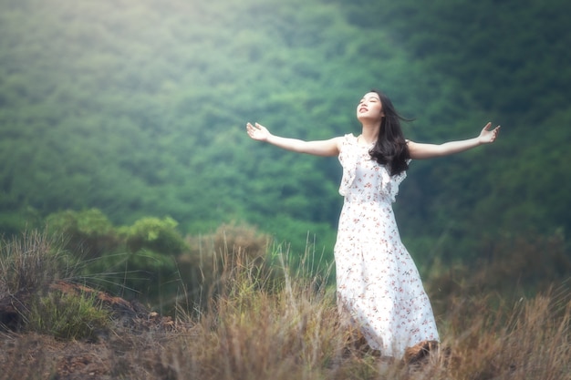 woman with open arms in the air