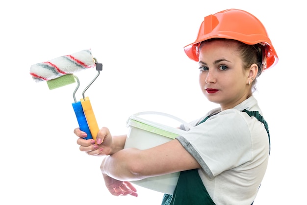 Woman with paint in bucket and tools isolated on white