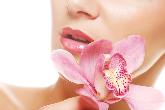 Woman with pink orchid