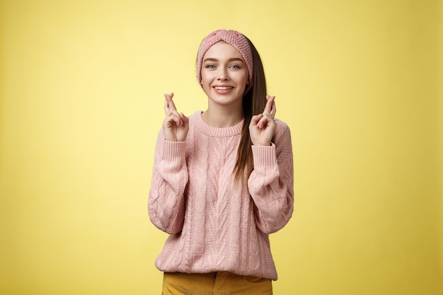 Woman with pink sweater over yellow