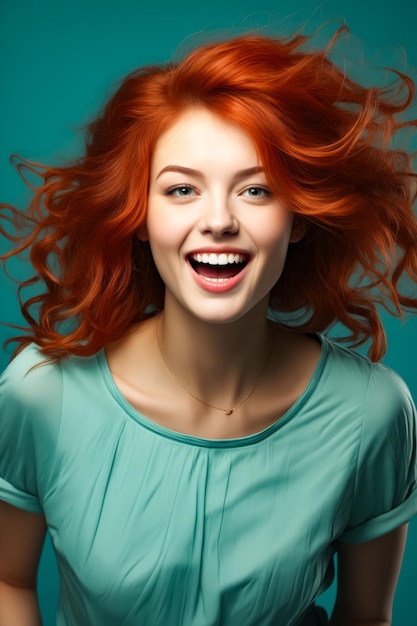 Woman with red hair smiling and looking at the camera