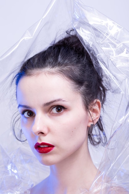 woman with red lips wrapped in plastic wrap High quality photo