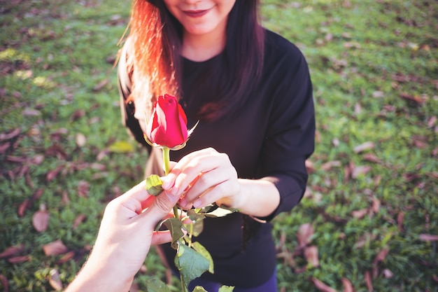 Woman with red rose