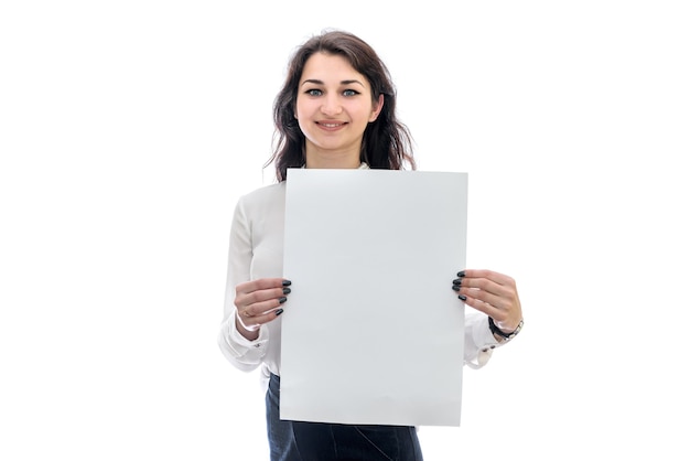 Woman with sheet of paper isolated on white wall