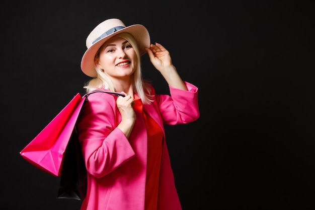 woman with shopping bags on black friday