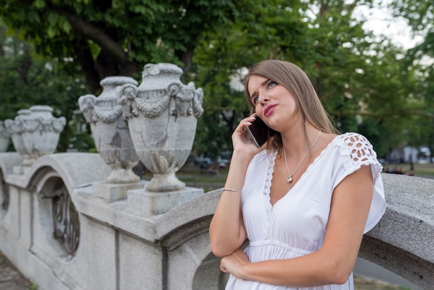 Woman with the smartphone outdoors