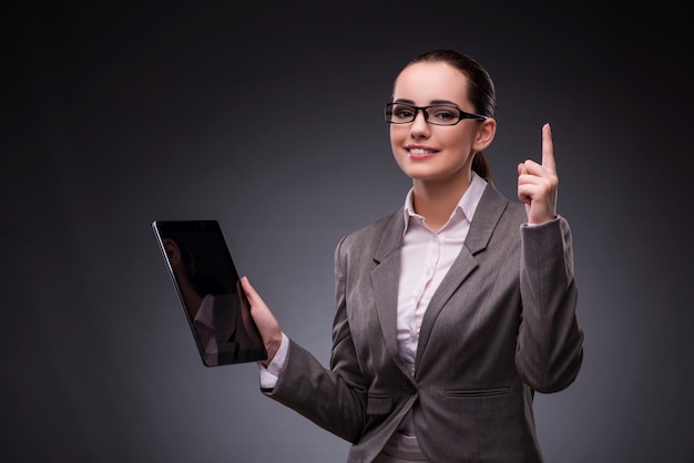 Woman with tablet computer in business 