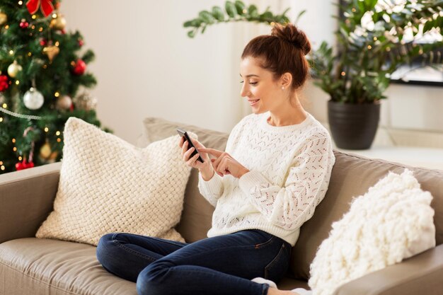 woman with tablet pc at home on christmas