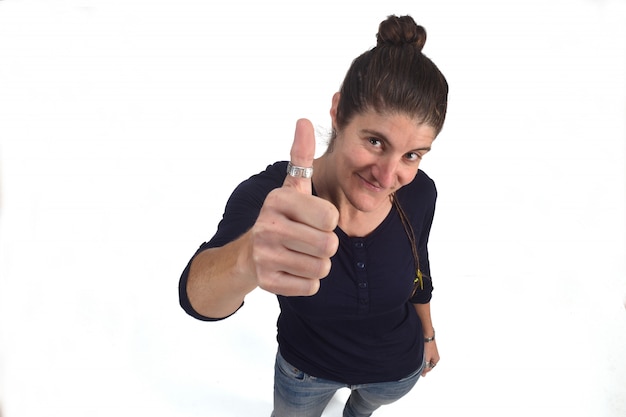 Woman with thumb up on white