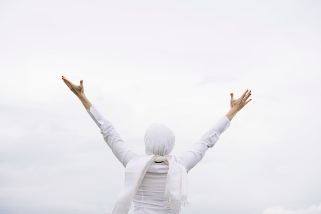 Woman with white headscarf