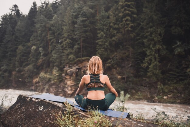 The woman in the wood, meditation outdoors yoga