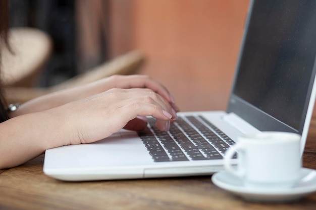 Woman working computer and coffee