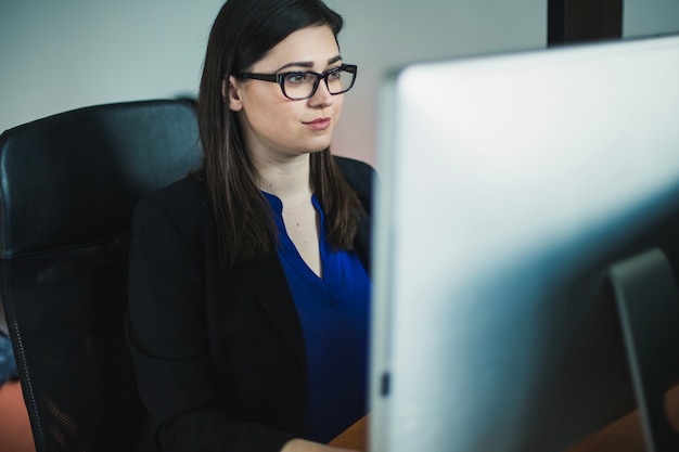 Woman working at computer in office