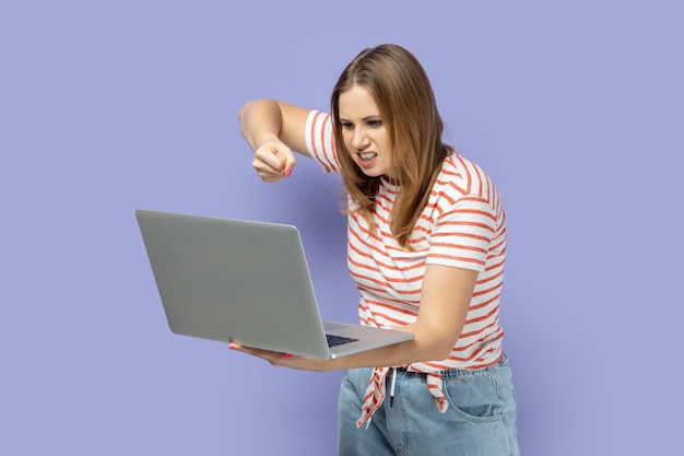 Woman working on laptop having online conversation boxing to notebook display