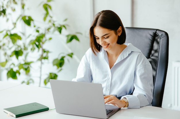 Woman working at the laptop in the office