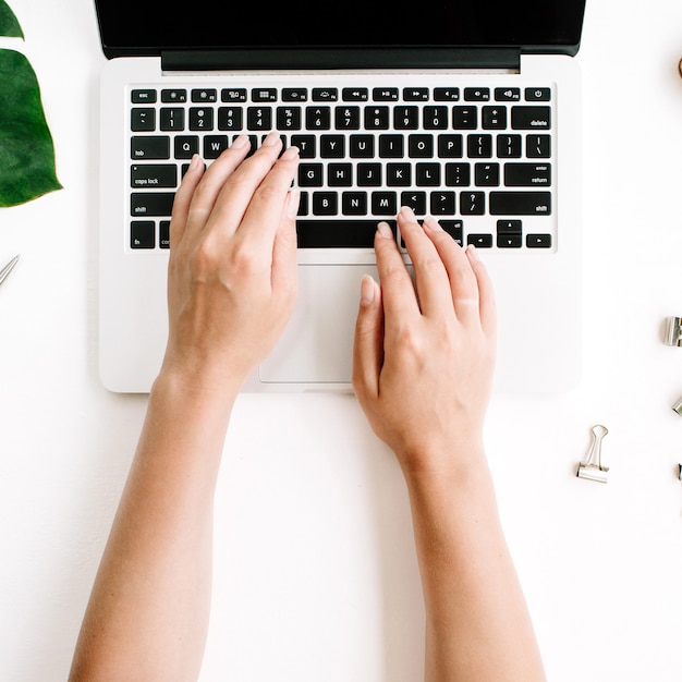 Woman working on laptop workspace