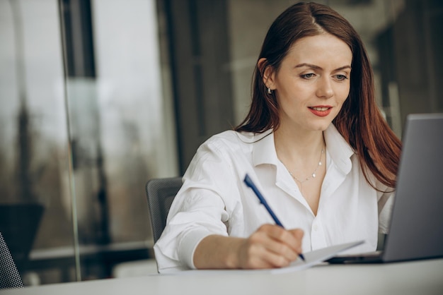 Woman working in office on a computer