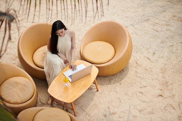 Woman Working on Tropical Beach