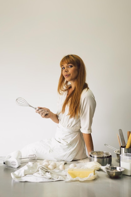 Woman working with dough preparation recipe bread pizza or pie making ingridients cooking cakes