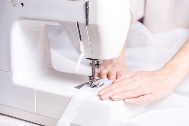 Woman working with sewing machine