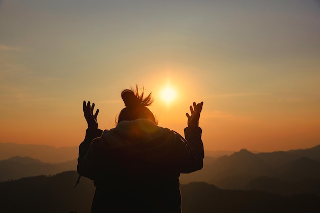 Woman worship on sunset