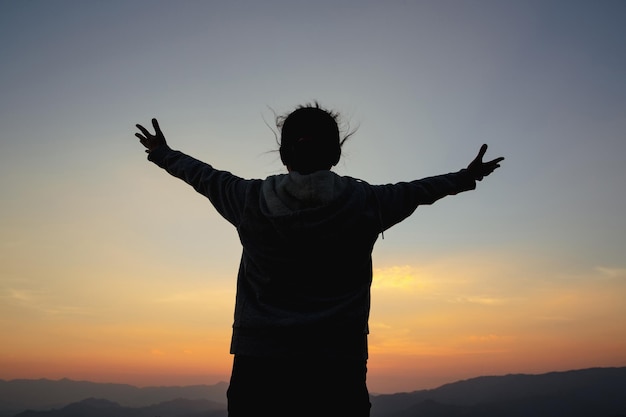 Woman worship on sunset