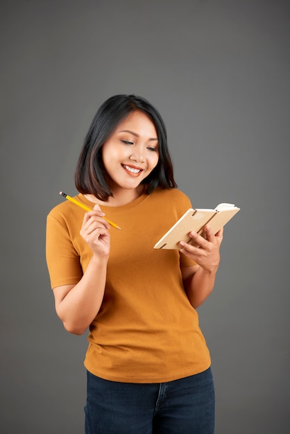 Woman writing in diary book