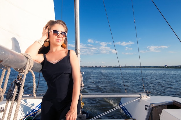 Woman on a yacht in sunglasses