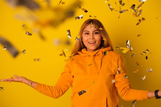 A woman in yellow clothes rejoices in a holiday