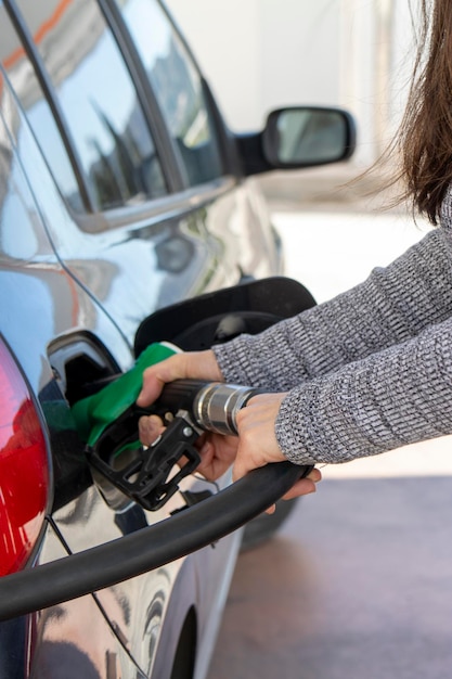 Woman39s hands refueling in the car