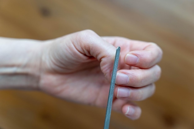 womans hands undergoing a professional manicure treatment