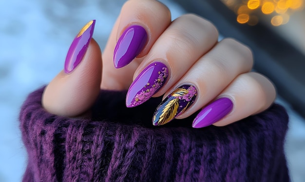 a womans nails with purple nails and gold nail polish