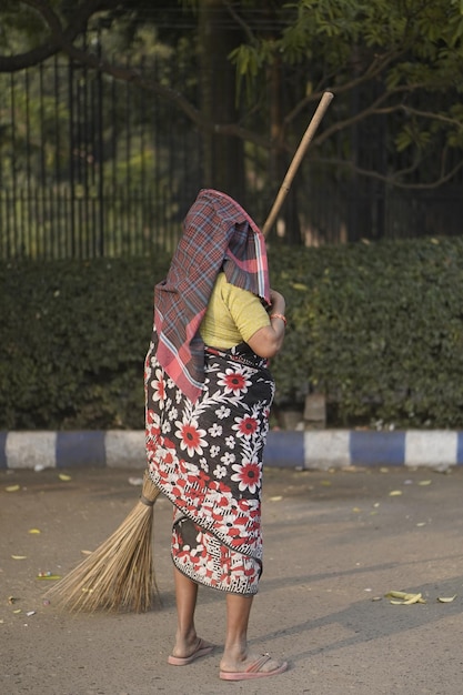 women cleaning road